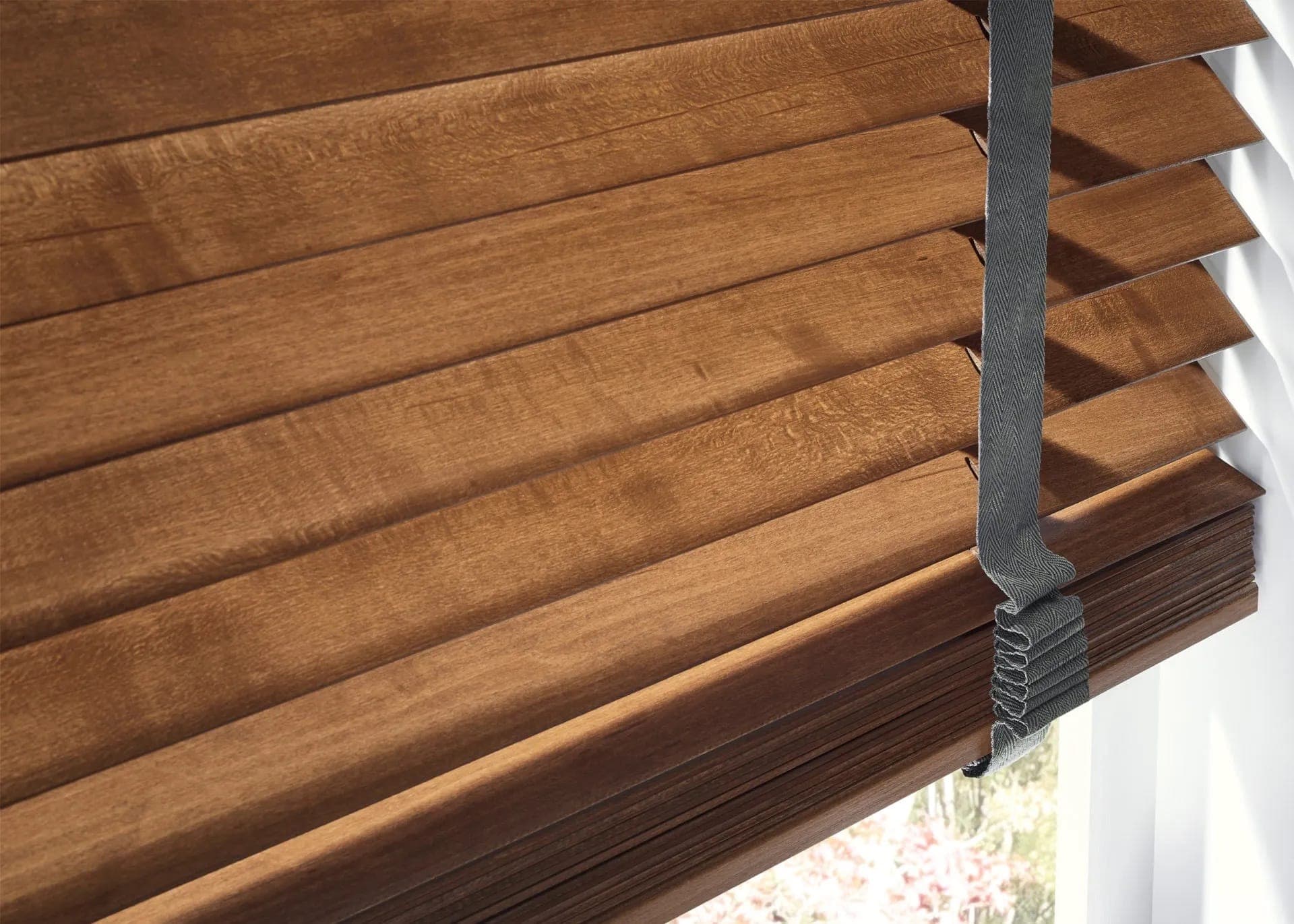 Faux wood blinds fitted to a living room window